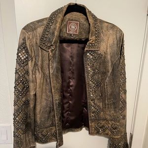 Medium leather jacket with jewel details on arms and back. Very comfortable!